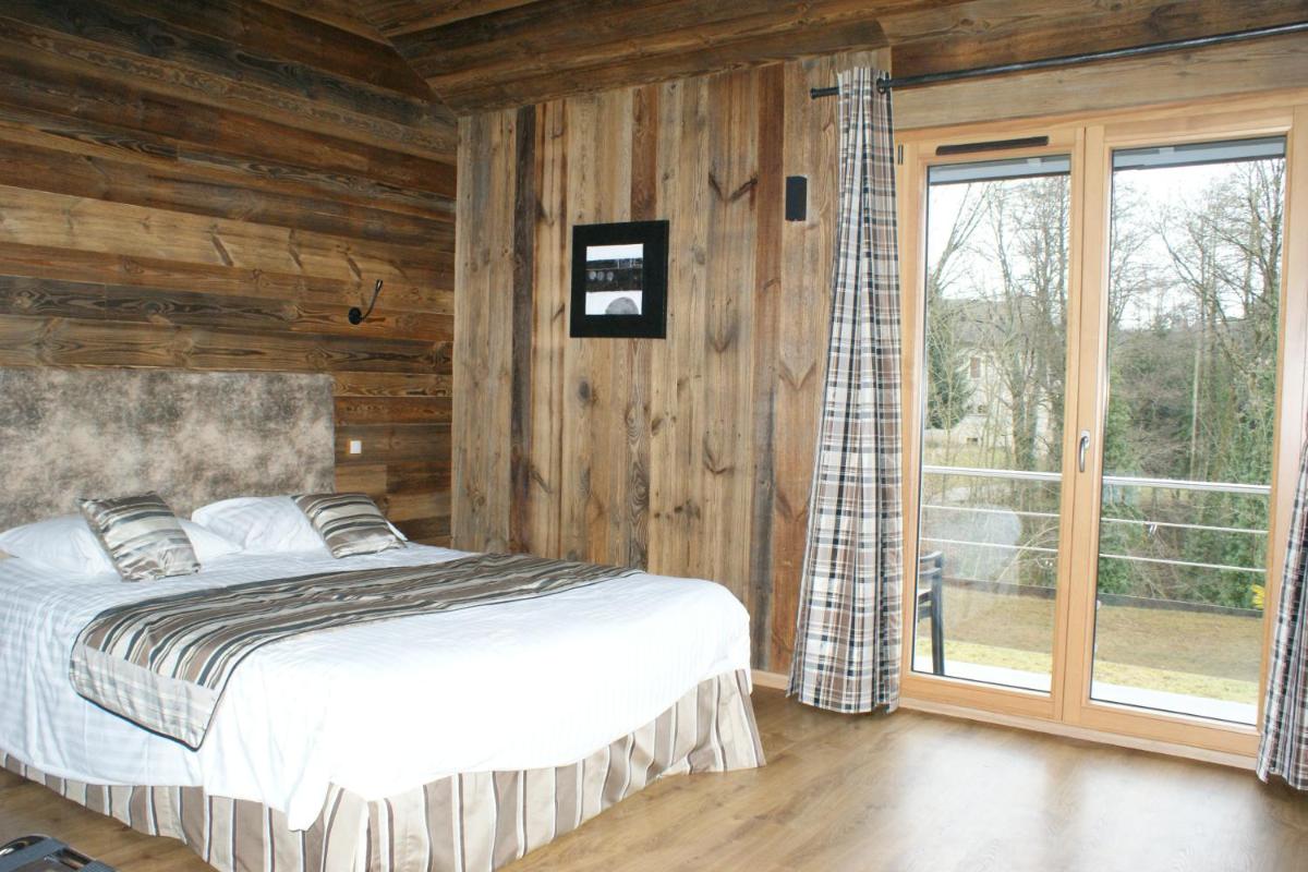 Un ou plusieurs lits dans un hébergement de l'établissement Hotel Blanc