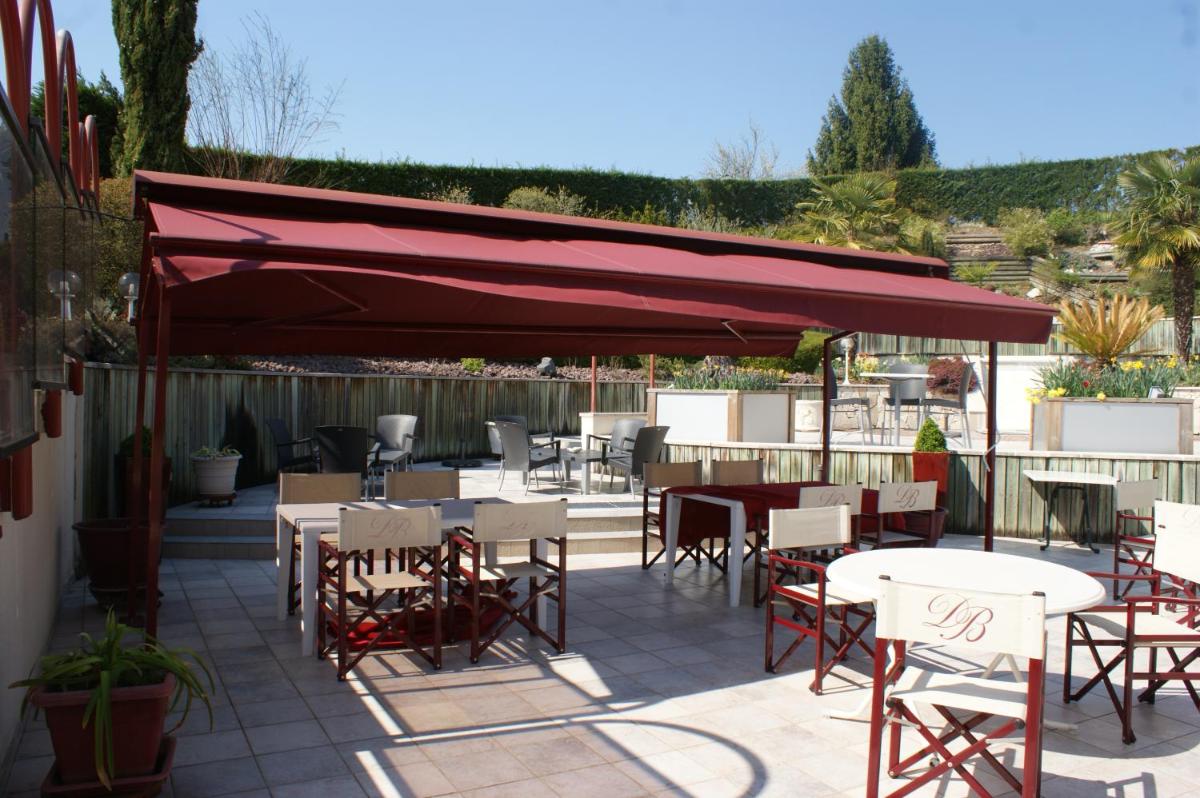 Restaurant ou autre lieu de restauration dans l'établissement Hotel Blanc