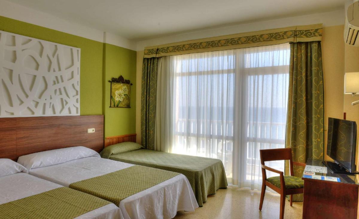 Cama o camas de una habitación en Hotel & Spa Entremares