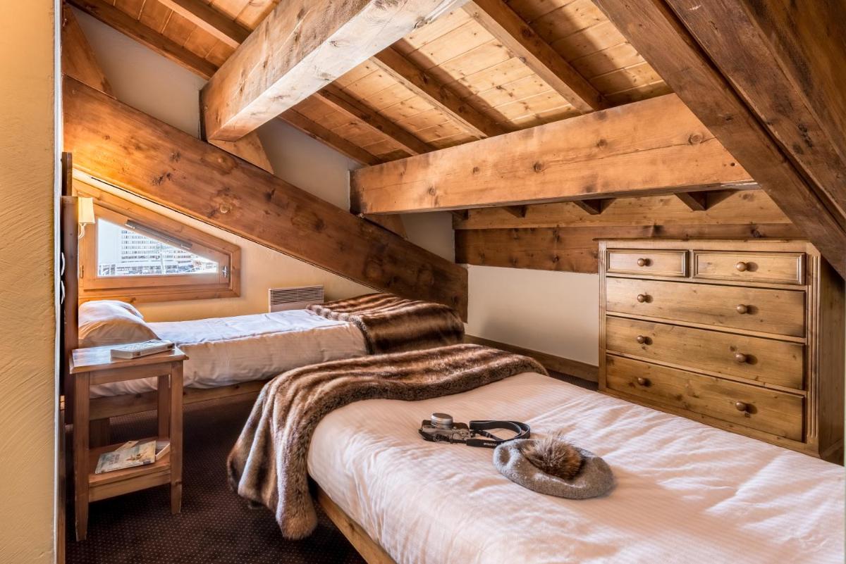 Un ou plusieurs lits dans un hébergement de l'établissement Résidences Village Montana by Les Etincelles
