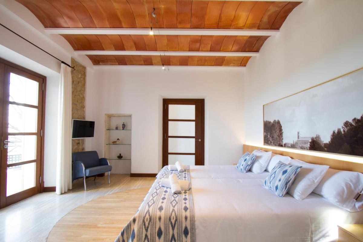 Cama o camas de una habitación en Can Cota Boutique - Turismo de interior