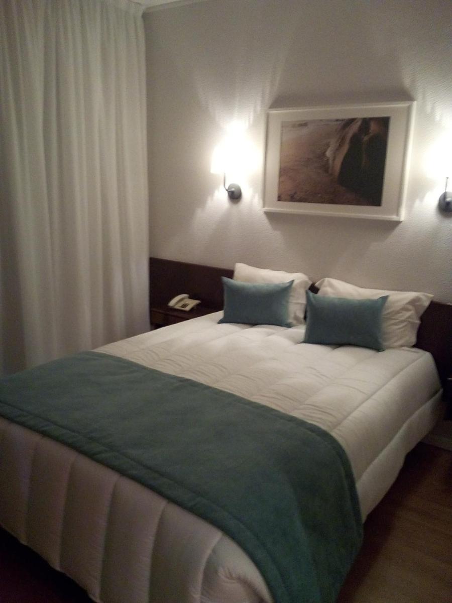 Uma cama ou camas num quarto em Hotel Costa de Prata 2 & Spa