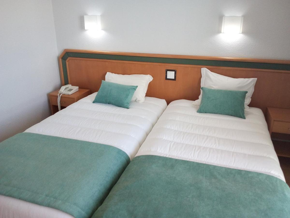 Uma cama ou camas num quarto em Hotel Costa de Prata 2 & Spa