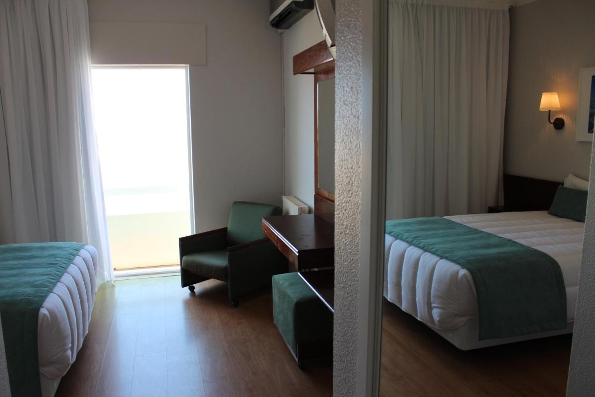 Uma cama ou camas num quarto em Hotel Costa de Prata 2 & Spa
