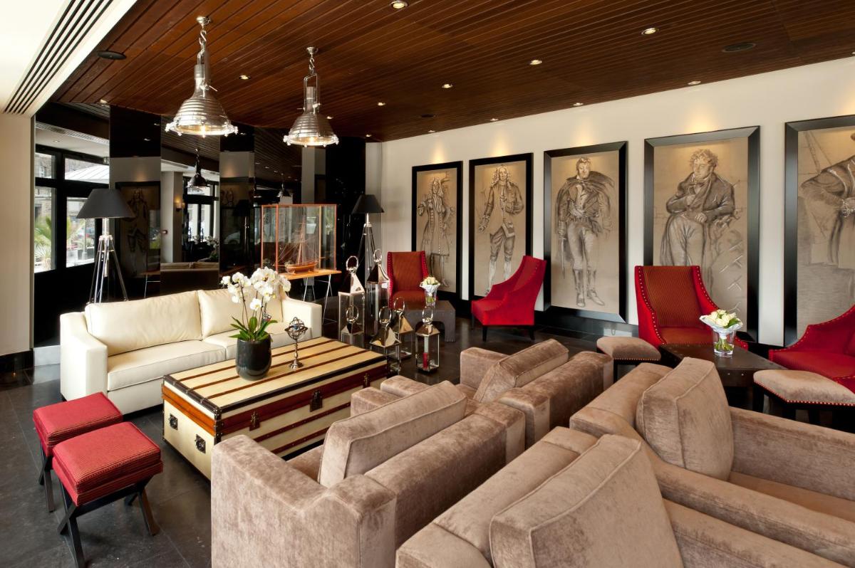 Coin salon dans l'établissement Hôtel Le Nouveau Monde