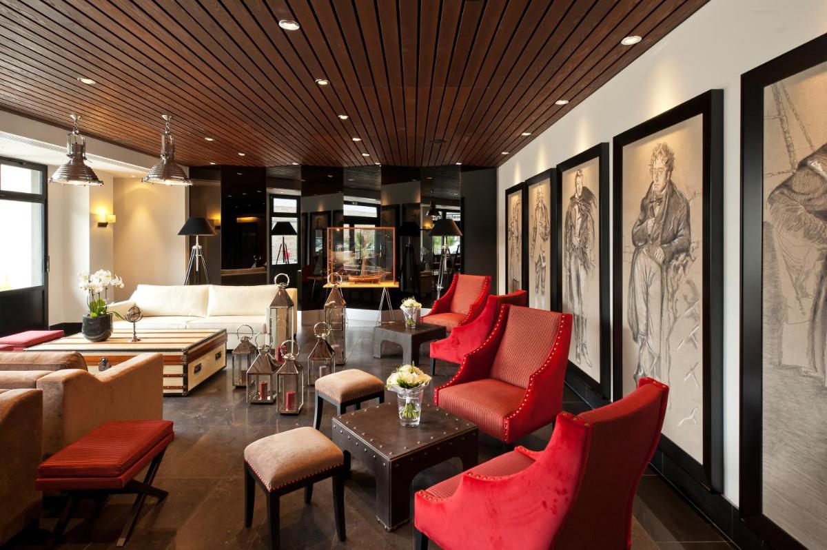 Coin salon dans l'établissement Hôtel Le Nouveau Monde
