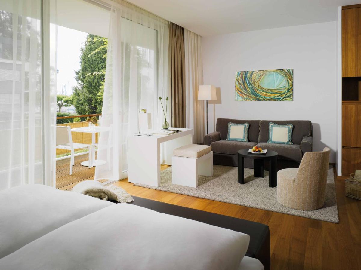 Ein Bett oder Betten in einem Zimmer der Unterkunft RIVA - Das Hotel am Bodensee