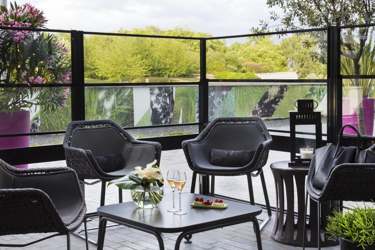 Coin salon dans l'établissement Hôtel Barrière Lille