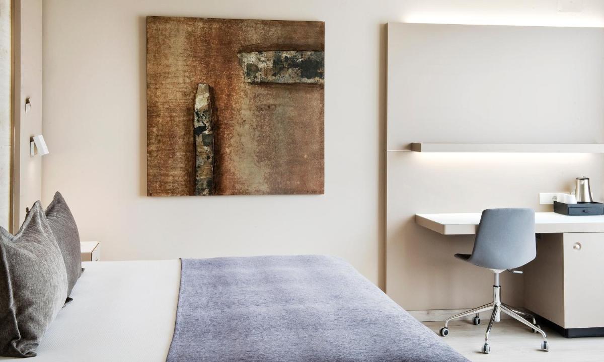 Cama o camas de una habitación en Sallés Hotel Pere IV