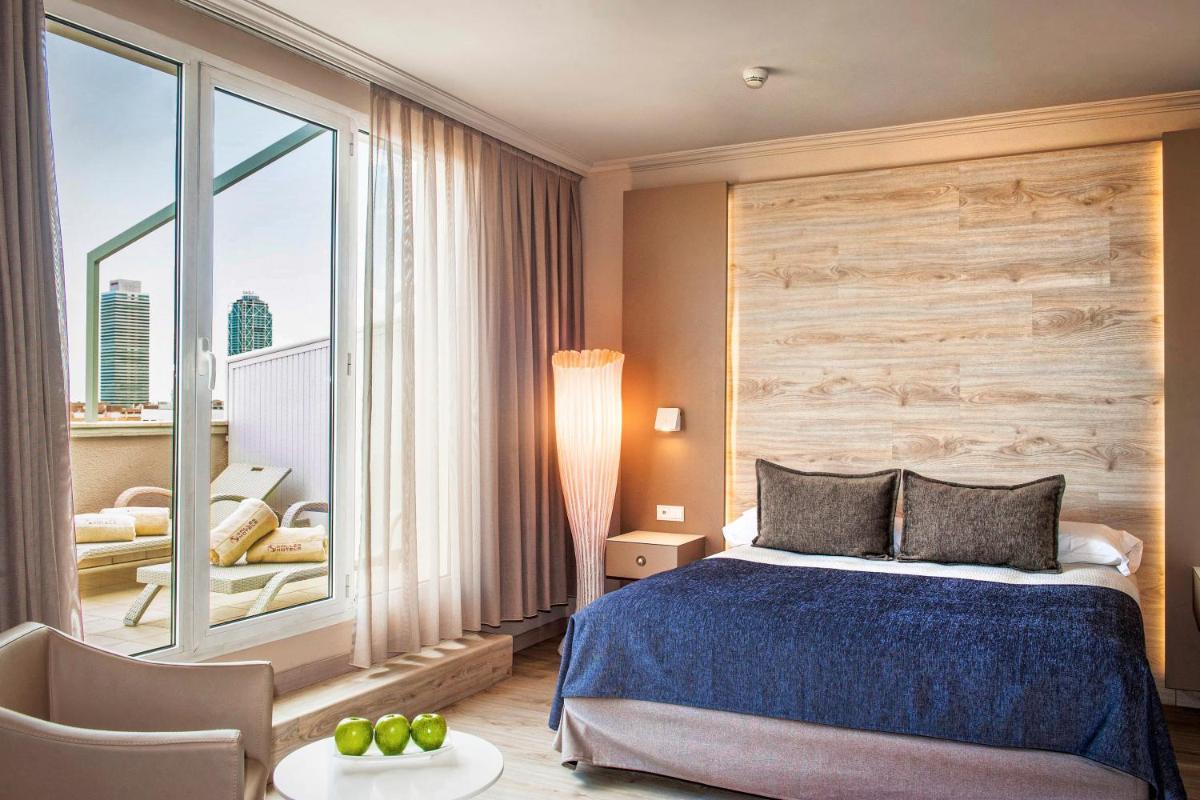 Cama o camas de una habitación en Sallés Hotel Pere IV