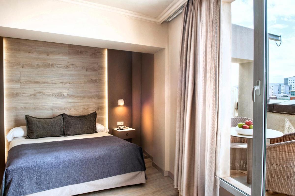 Cama o camas de una habitación en Sallés Hotel Pere IV