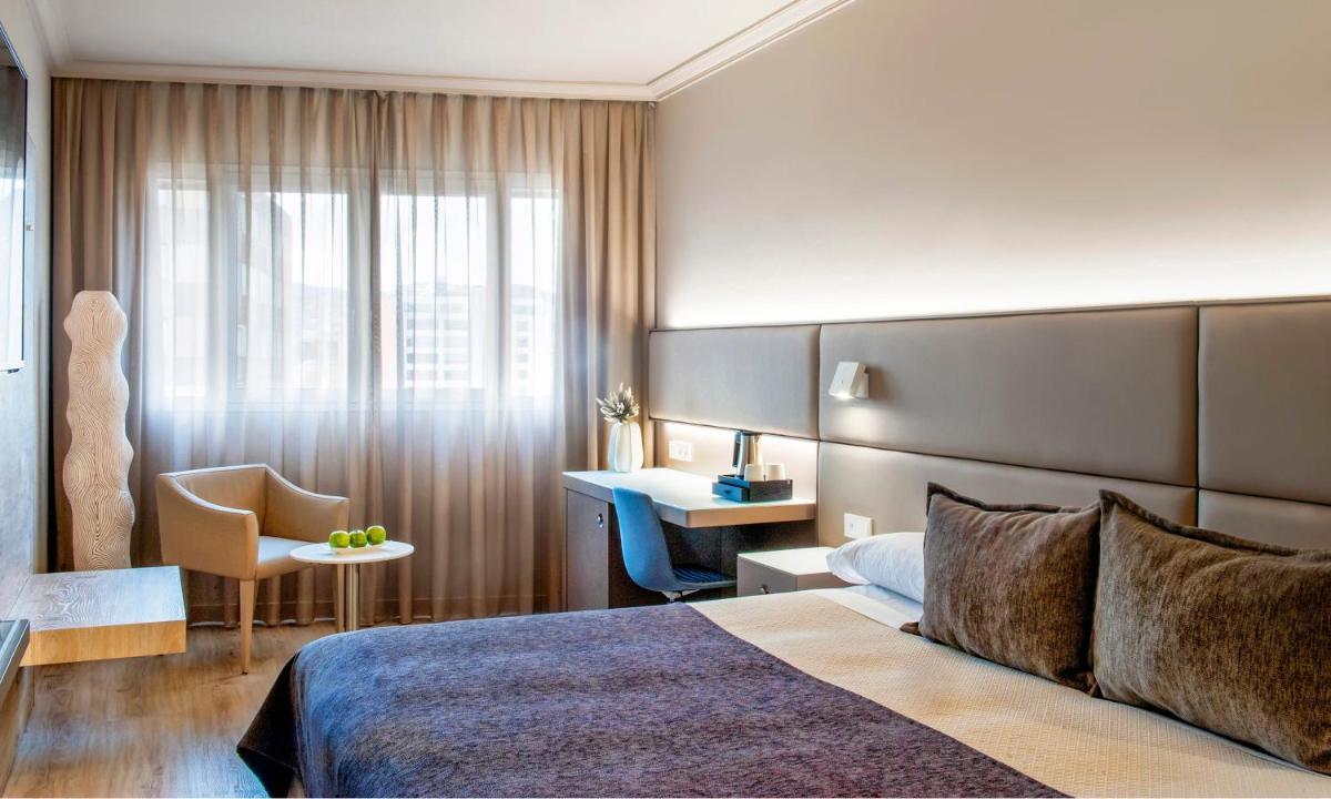 Cama o camas de una habitación en Sallés Hotel Pere IV
