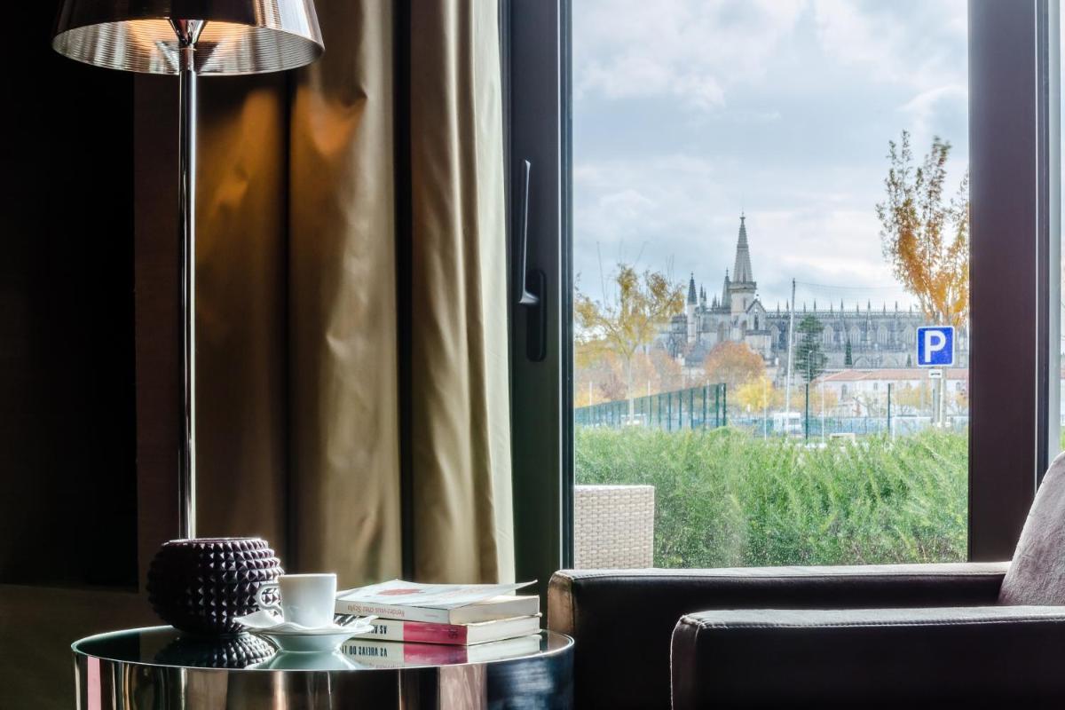 Uma área de estar em Hotel Villa Batalha