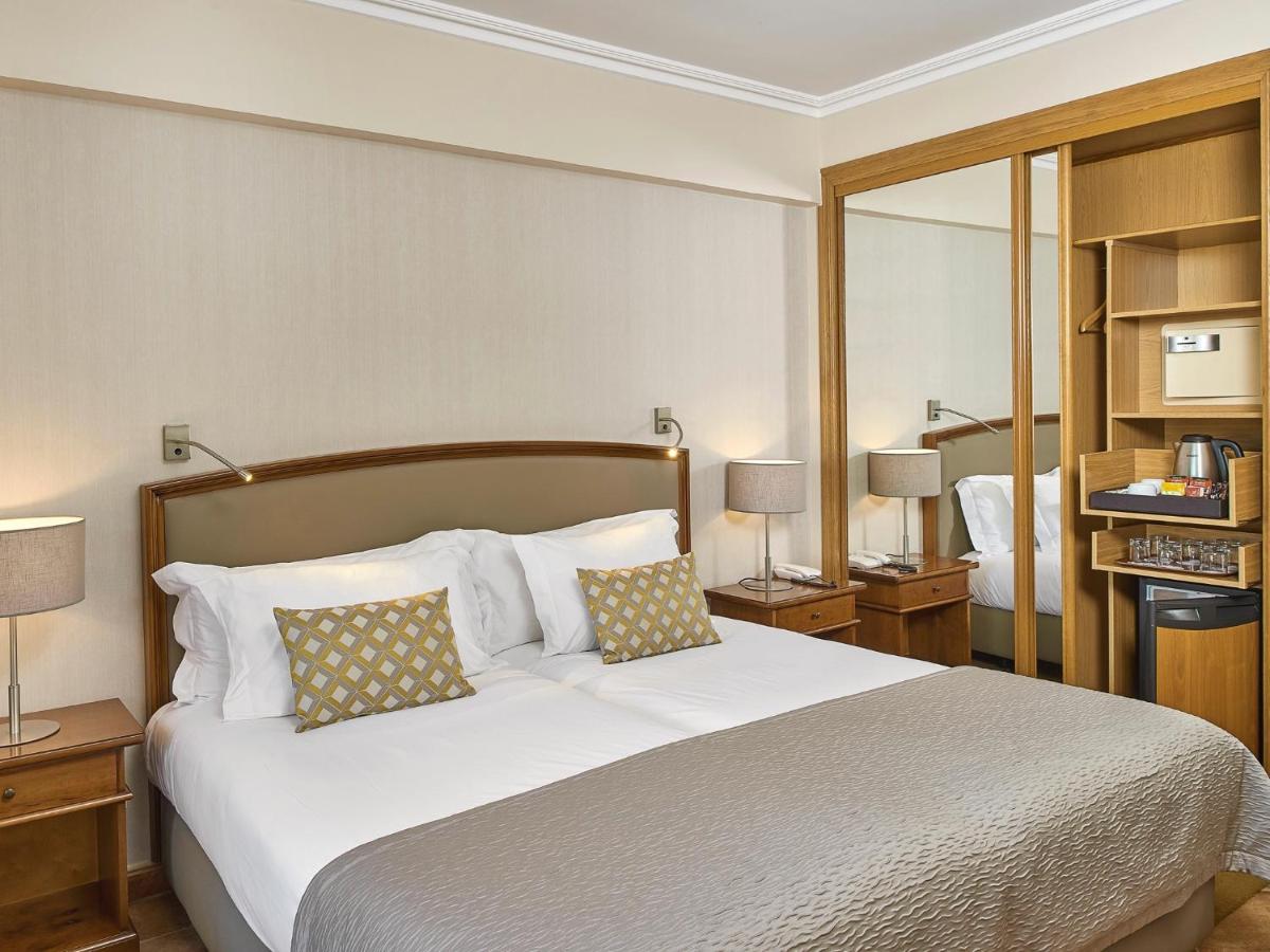 Uma cama ou camas num quarto em Ria Park Hotel & Spa