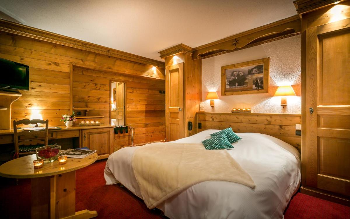 Un ou plusieurs lits dans un hébergement de l'établissement Hotel & Spa Le Dahu