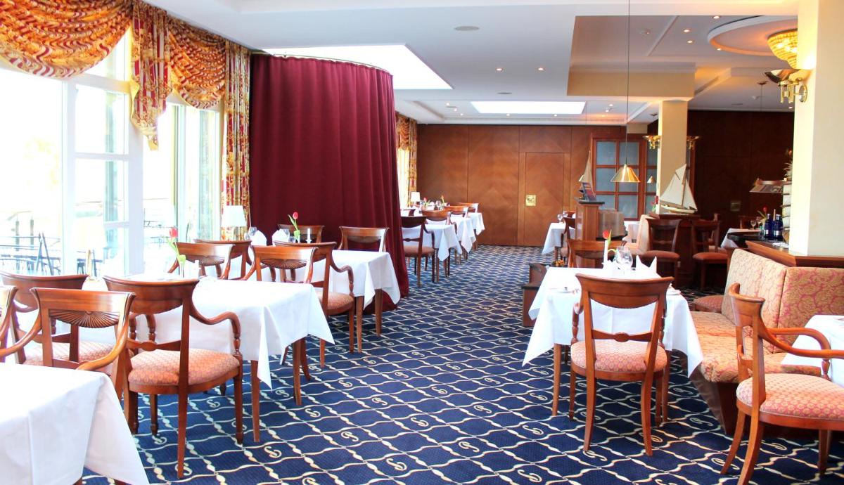 Ein Restaurant oder anderes Speiselokal in der Unterkunft Usedom Palace