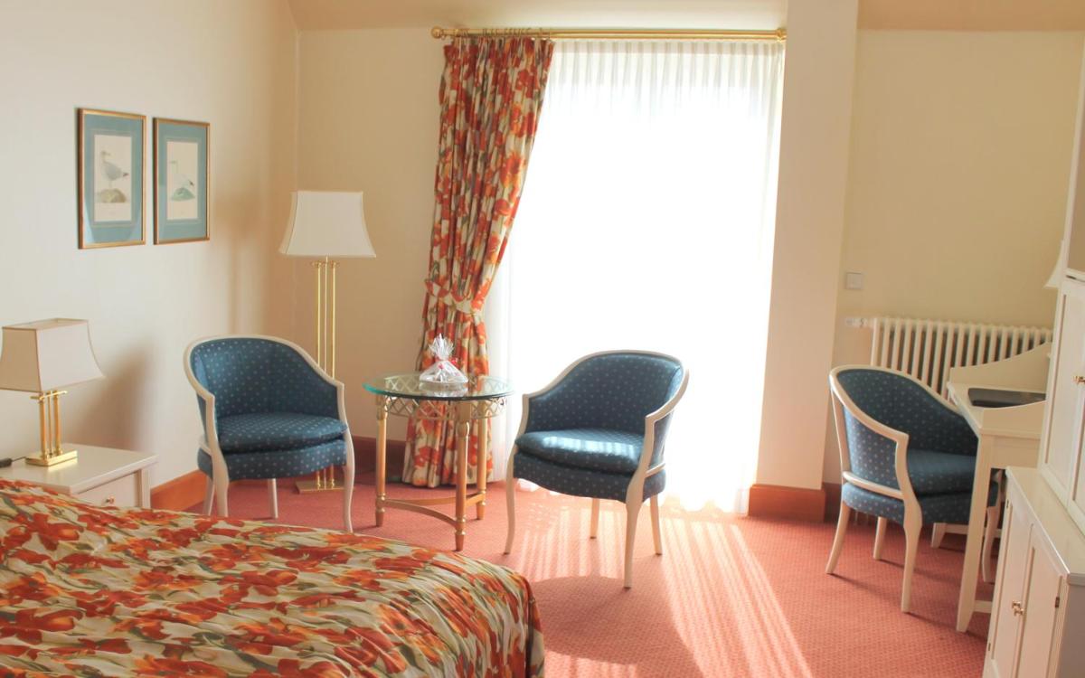 Ein Bett oder Betten in einem Zimmer der Unterkunft Usedom Palace