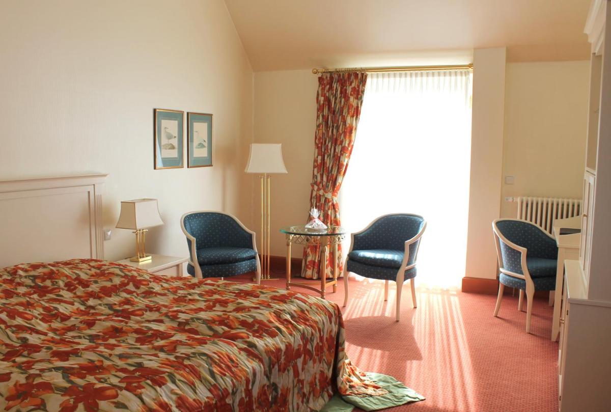 Ein Bett oder Betten in einem Zimmer der Unterkunft Usedom Palace