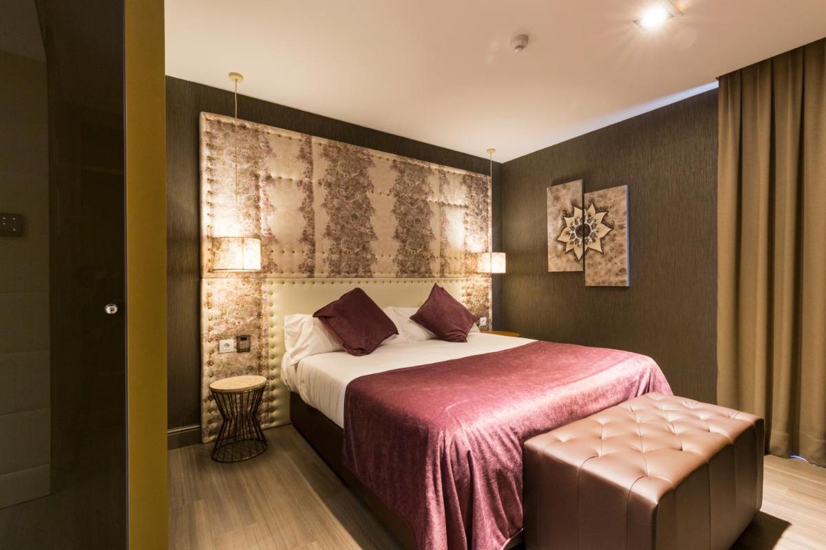 Cama o camas de una habitación en Sant Jordi Boutique Hotel