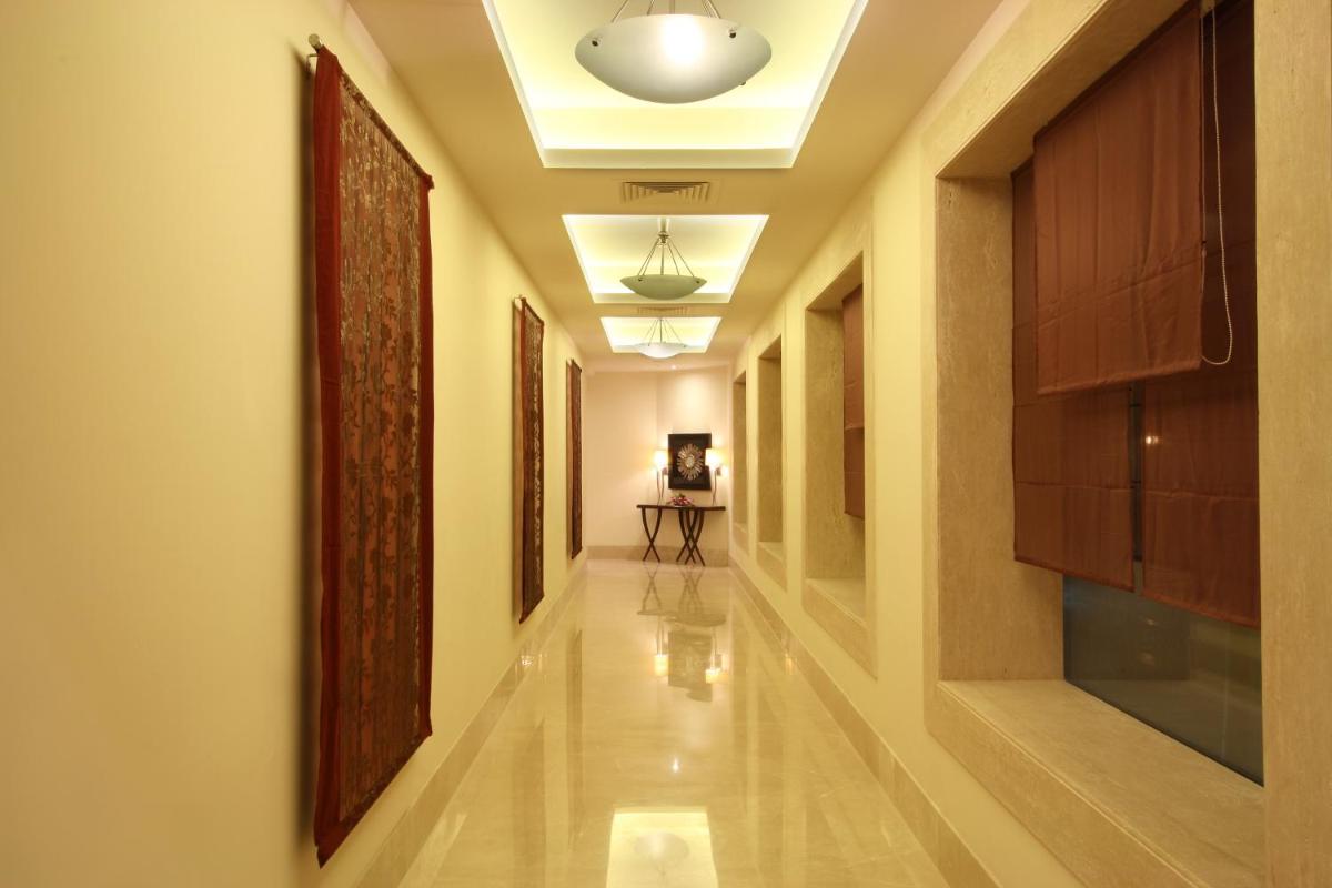 a corridor in a building with a hallway at Radisson Hyderabad Hitec City in Hyderabad