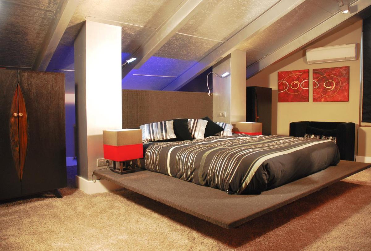 Cama o camas de una habitación en Hotel Cardamomo Sigüenza