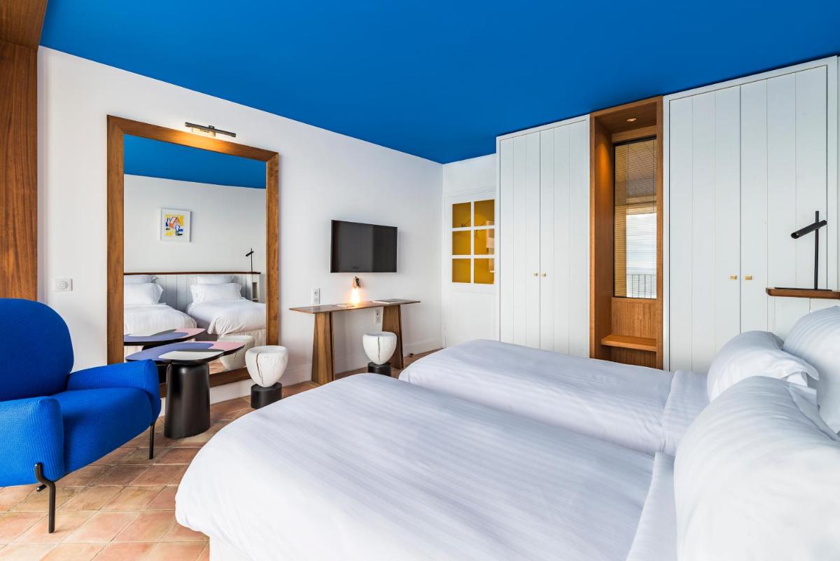 Un ou plusieurs lits dans un hébergement de l'établissement Hôtel Le Bailli De Suffren