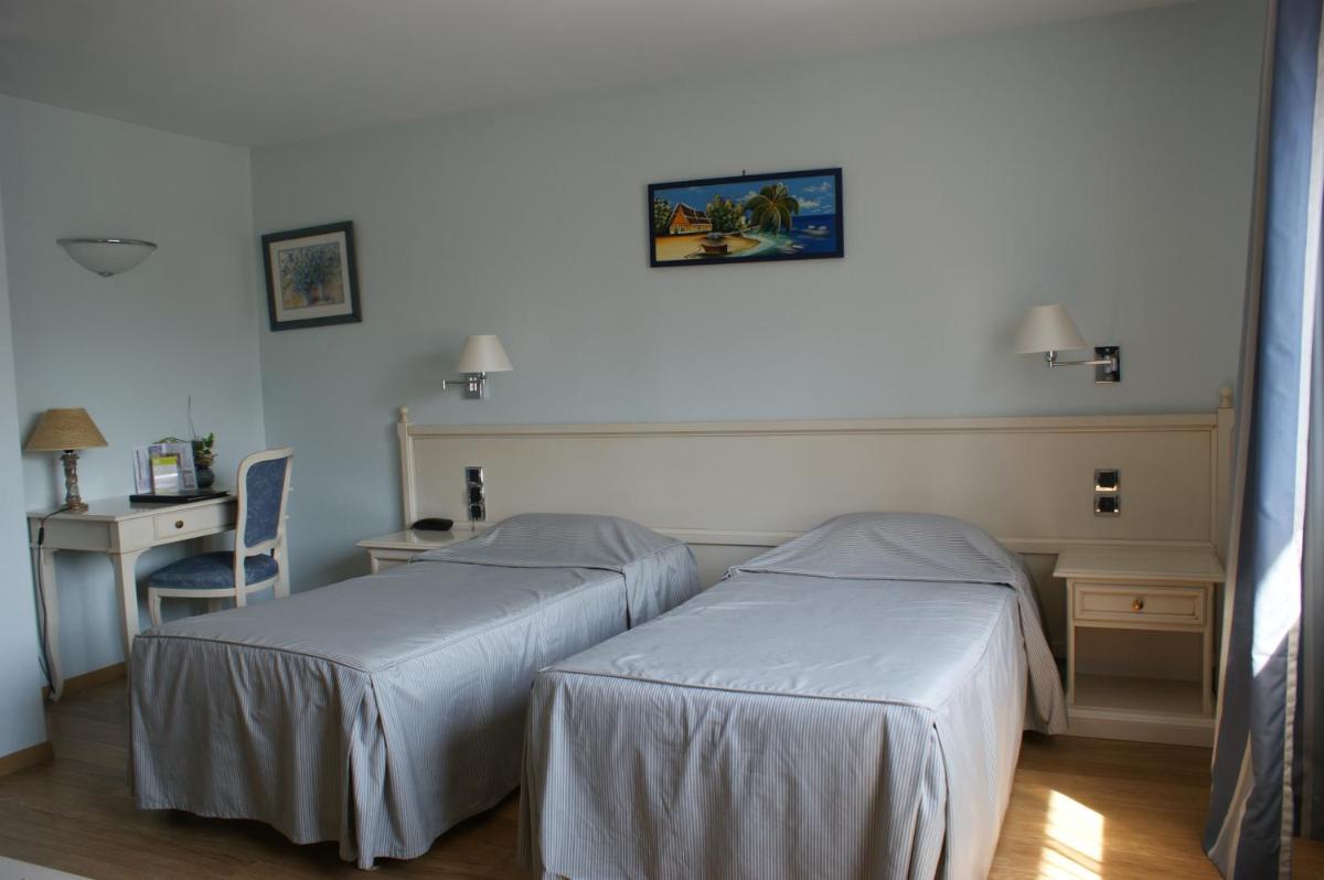 Un ou plusieurs lits dans un hébergement de l'établissement Hotel Blanc