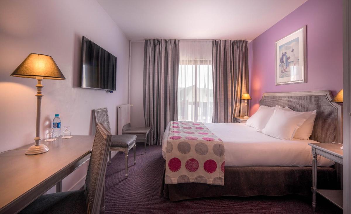 Un ou plusieurs lits dans un hébergement de l'établissement Best Western Plus Hostellerie Du Vallon