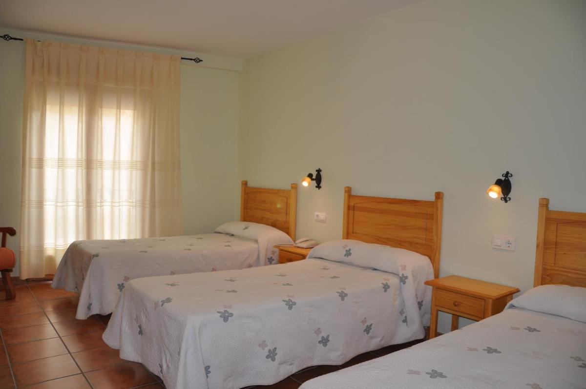 Cama o camas de una habitación en Hotel Castellote