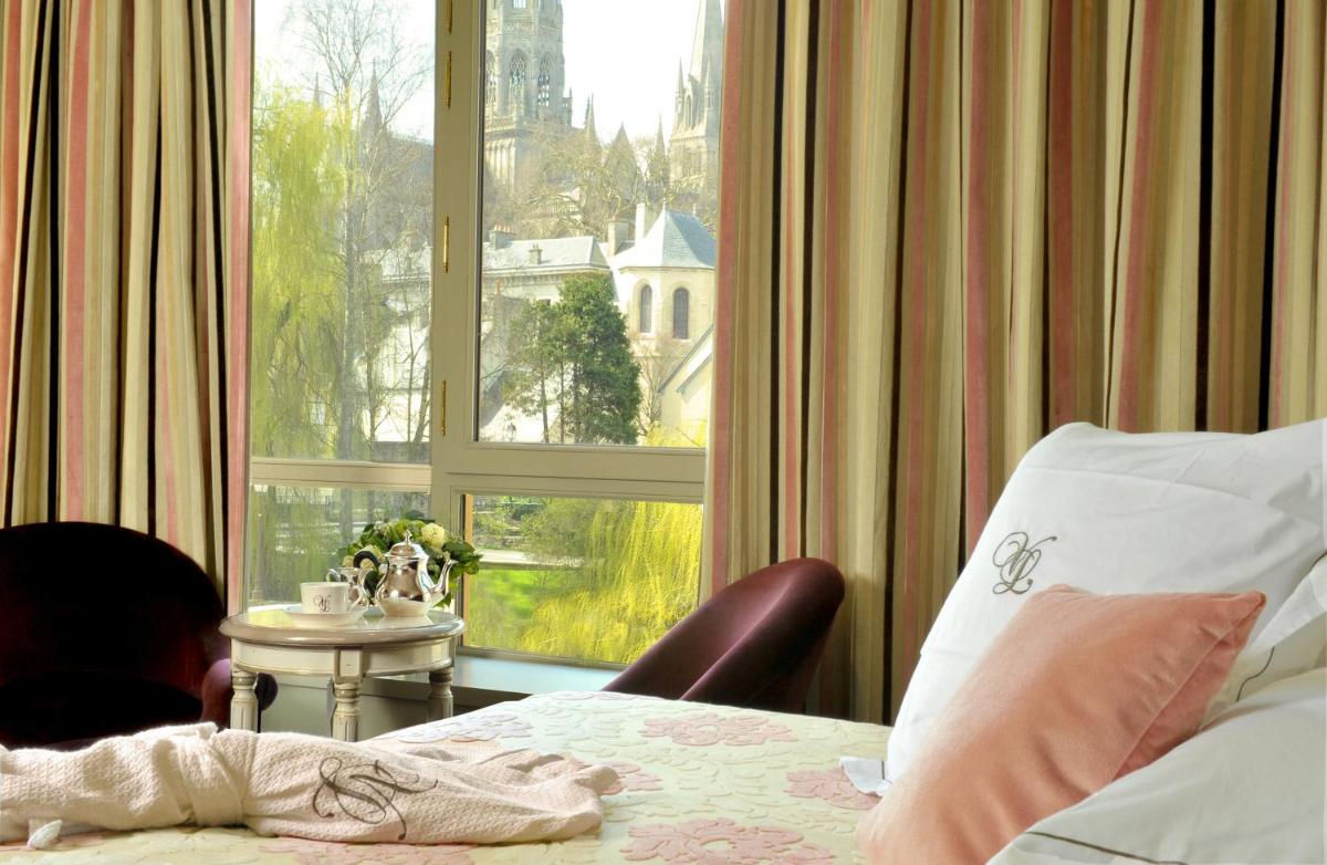 Un ou plusieurs lits dans un hébergement de l'établissement Villa Lara Hotel
