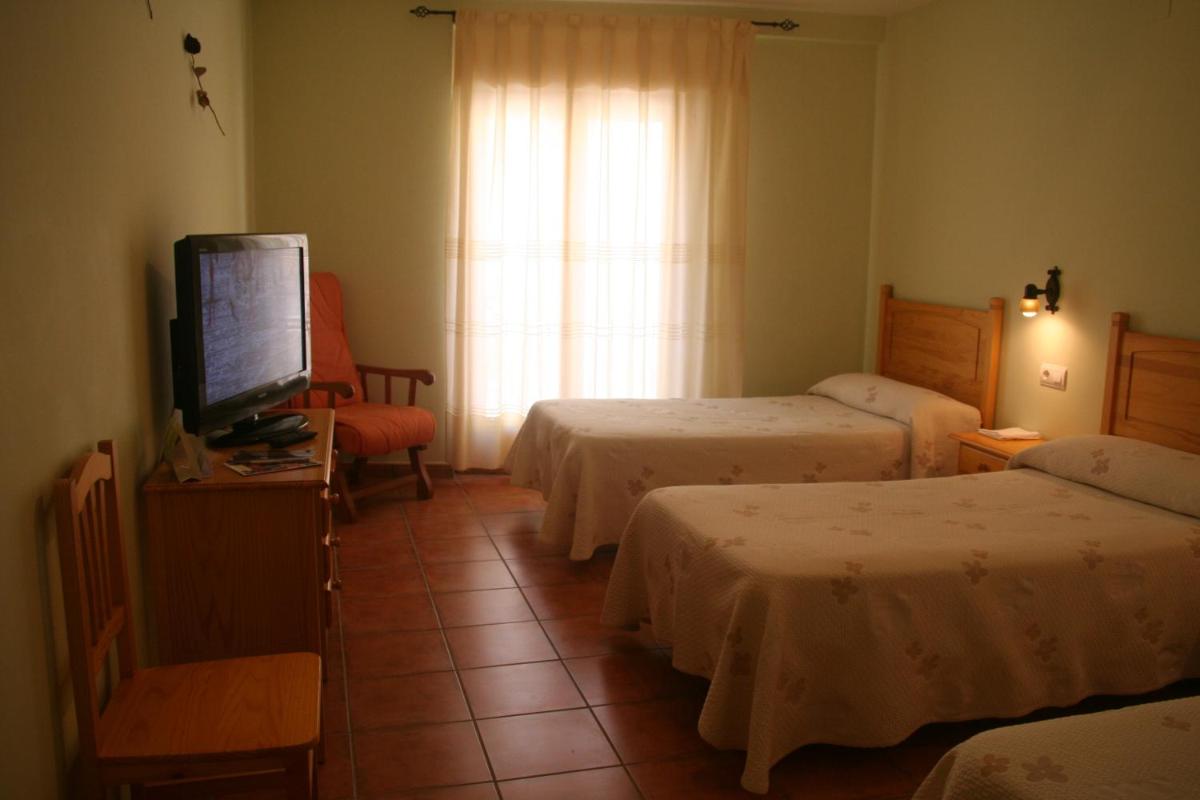 Cama o camas de una habitación en Hotel Castellote