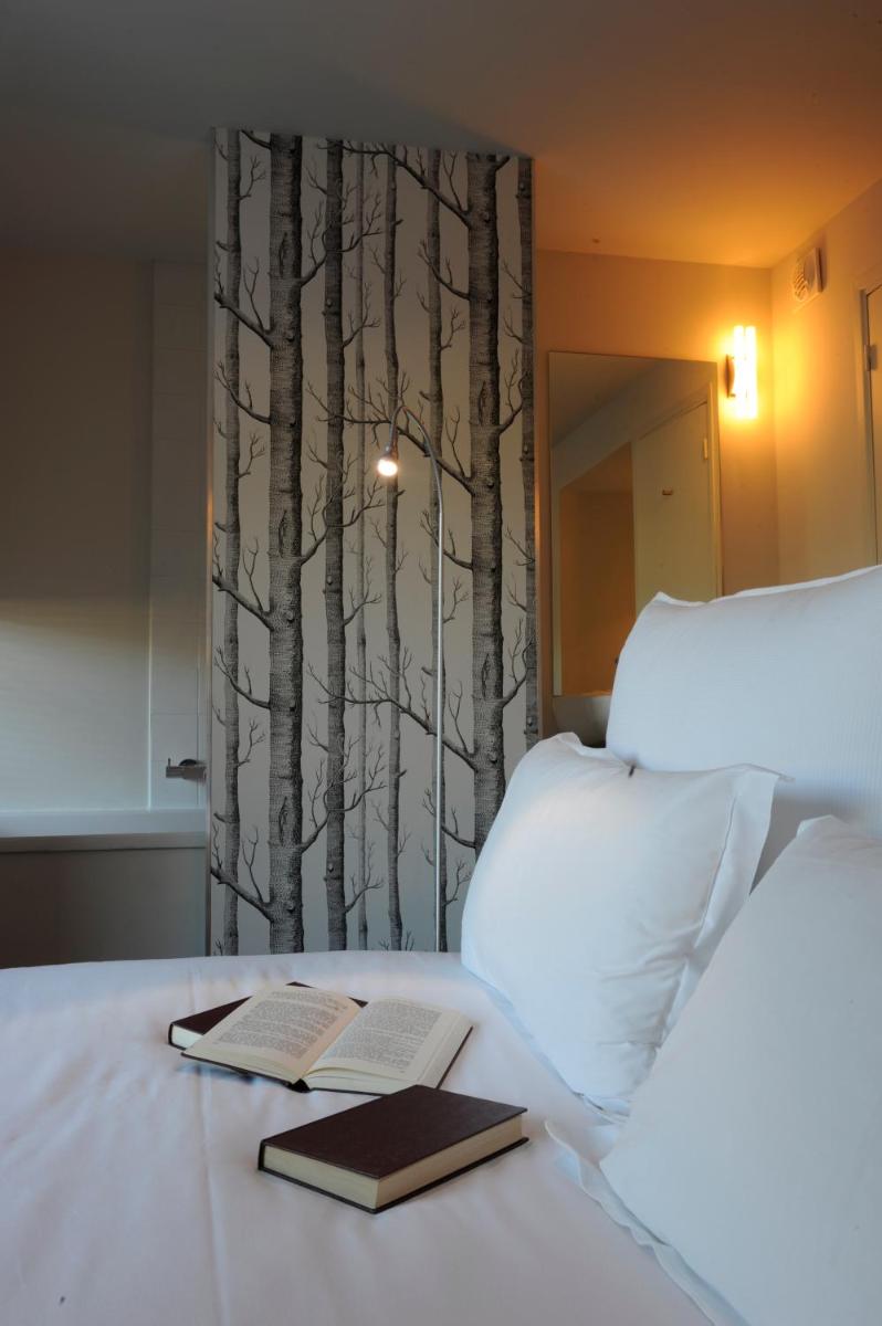 Un ou plusieurs lits dans un hébergement de l'établissement Artemisia Boutique Hotel