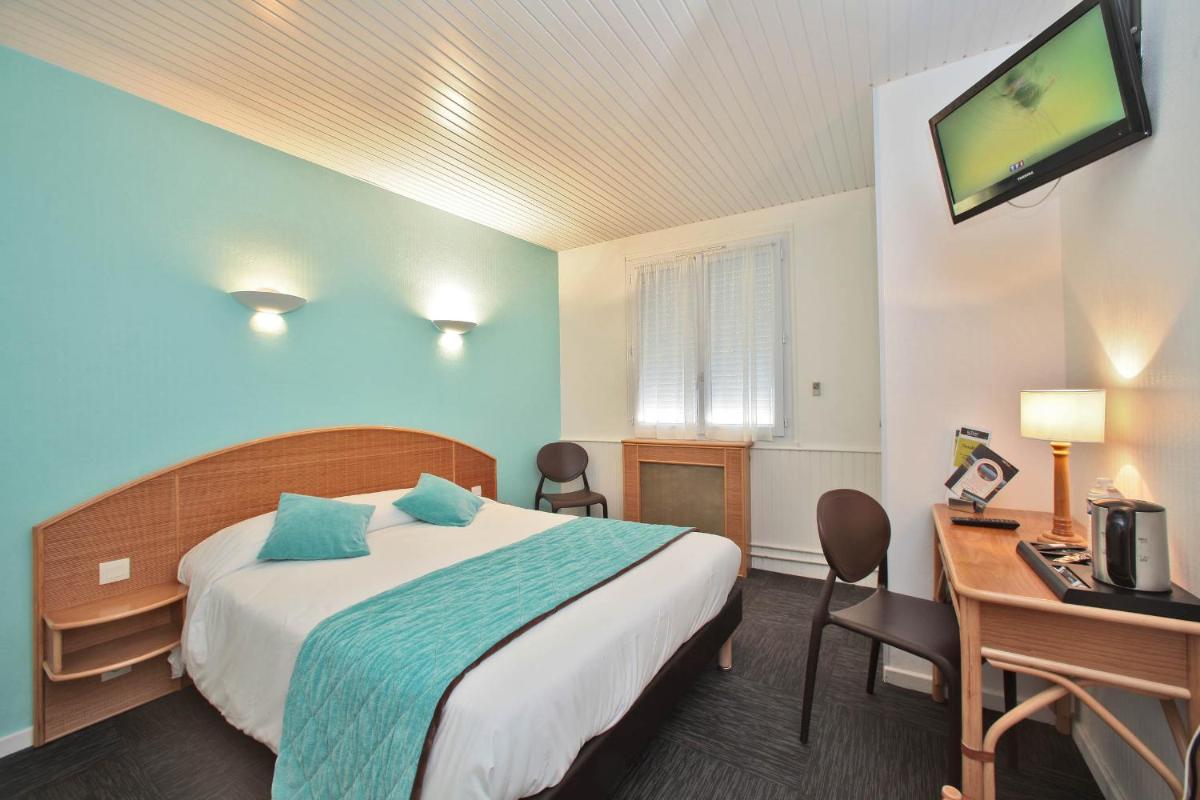 Un ou plusieurs lits dans un hébergement de l'établissement Hotel Les Dunes