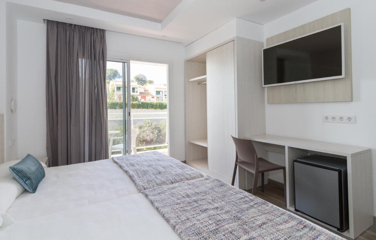 Cama o camas de una habitación en Hotel Oasis Park Splash