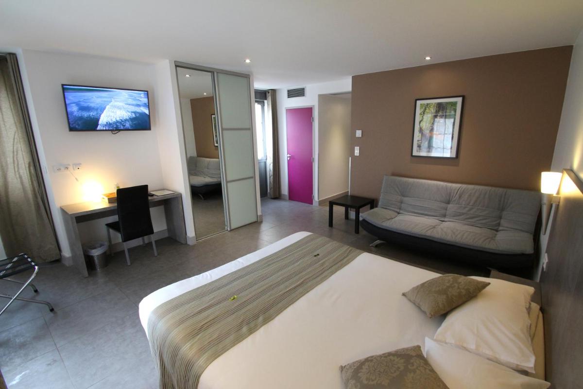 Un ou plusieurs lits dans un hébergement de l'établissement Logis Hotel Archambeau