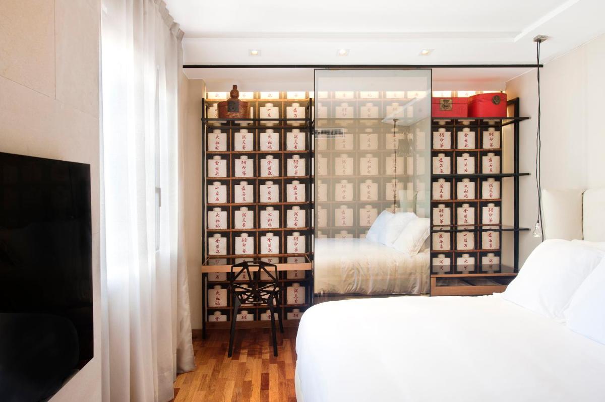 Cama o camas de una habitación en Claris Hotel & Spa GL, a Small Luxury Hotel of the World