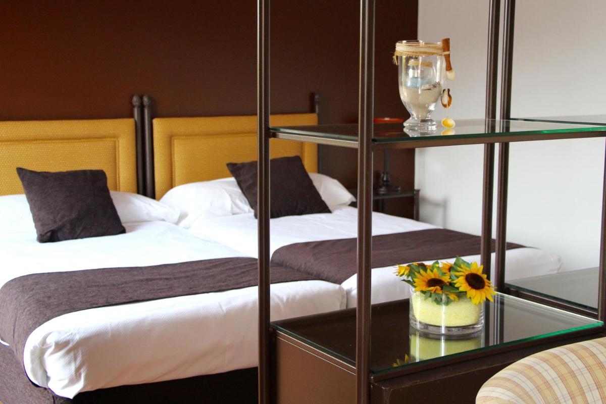 Cama o camas de una habitación en Termes Montbrio Hotel & Spa