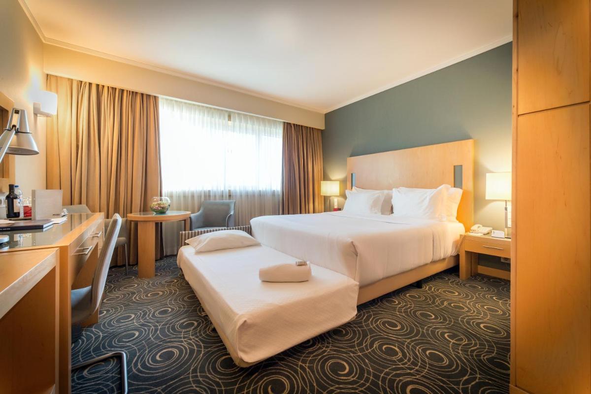 Uma cama ou camas num quarto em SANA Malhoa Hotel