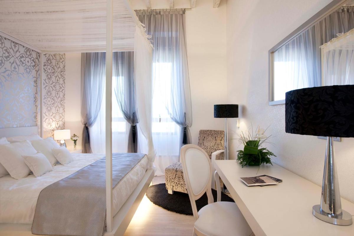 Cama o camas de una habitación en Hotel AF Pesquera