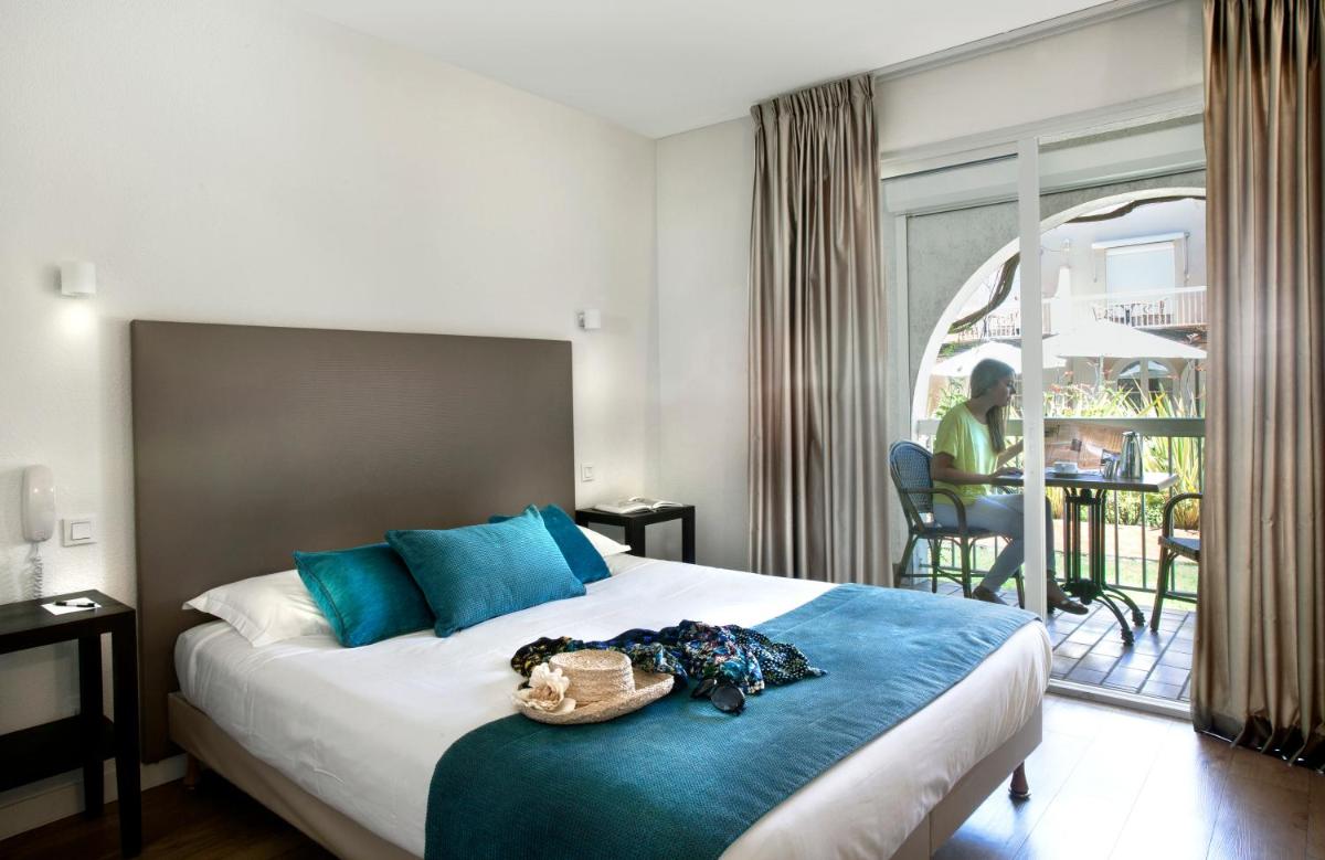 Un ou plusieurs lits dans un hébergement de l'établissement Le Cottage - Hotel & Spa