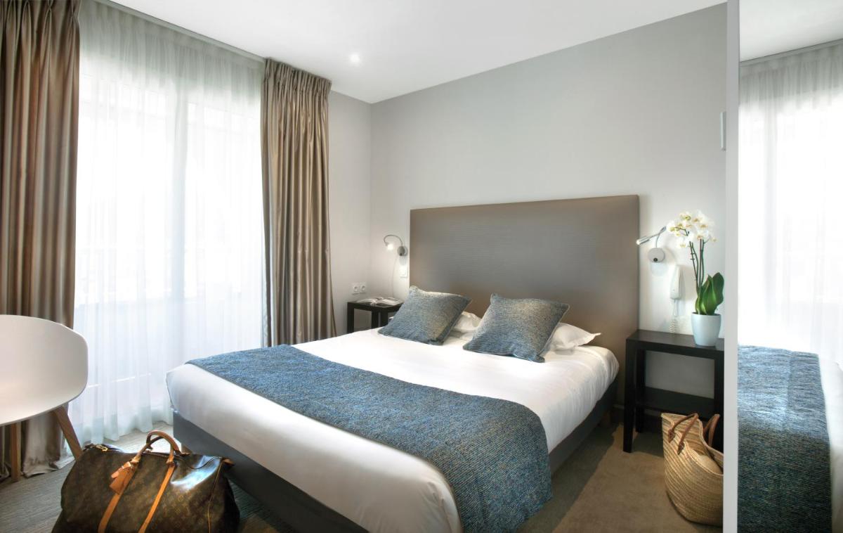 Un ou plusieurs lits dans un hébergement de l'établissement Le Cottage - Hotel & Spa