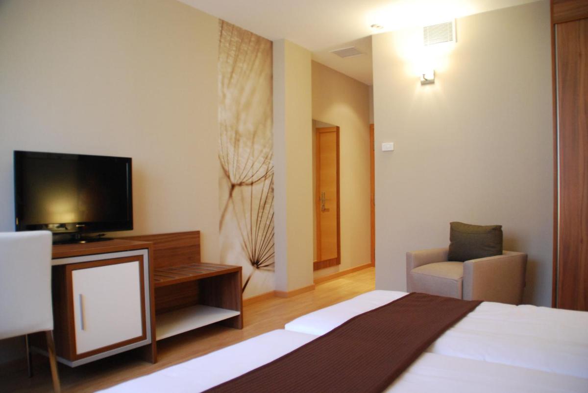 Cama o camas de una habitación en Hotel & Spa Golden Barcelona