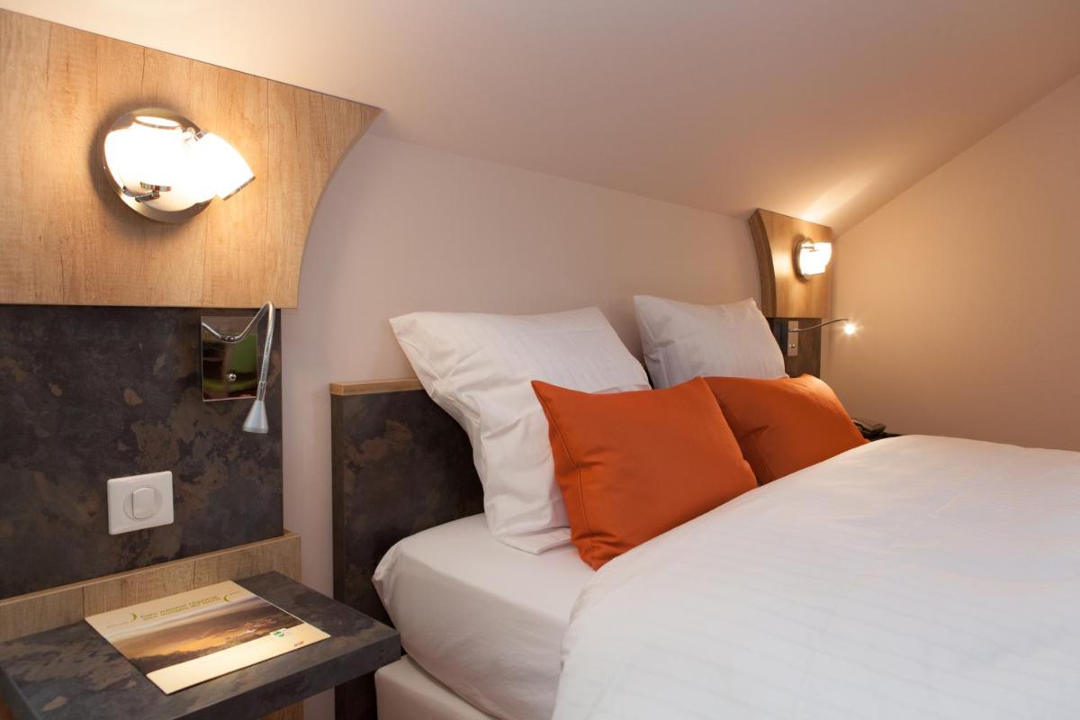 Un ou plusieurs lits dans un hébergement de l'établissement Hotel Restaurant Le Cleebourg