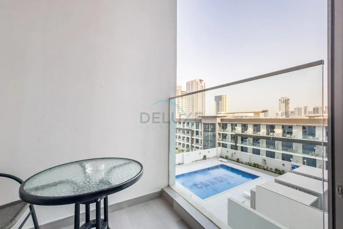 Pool View Studio with Balcony Close to Mall, Concept 7 Residences, Jumeirah Village Circle by Deluxe Holiday Homes — صورة 3