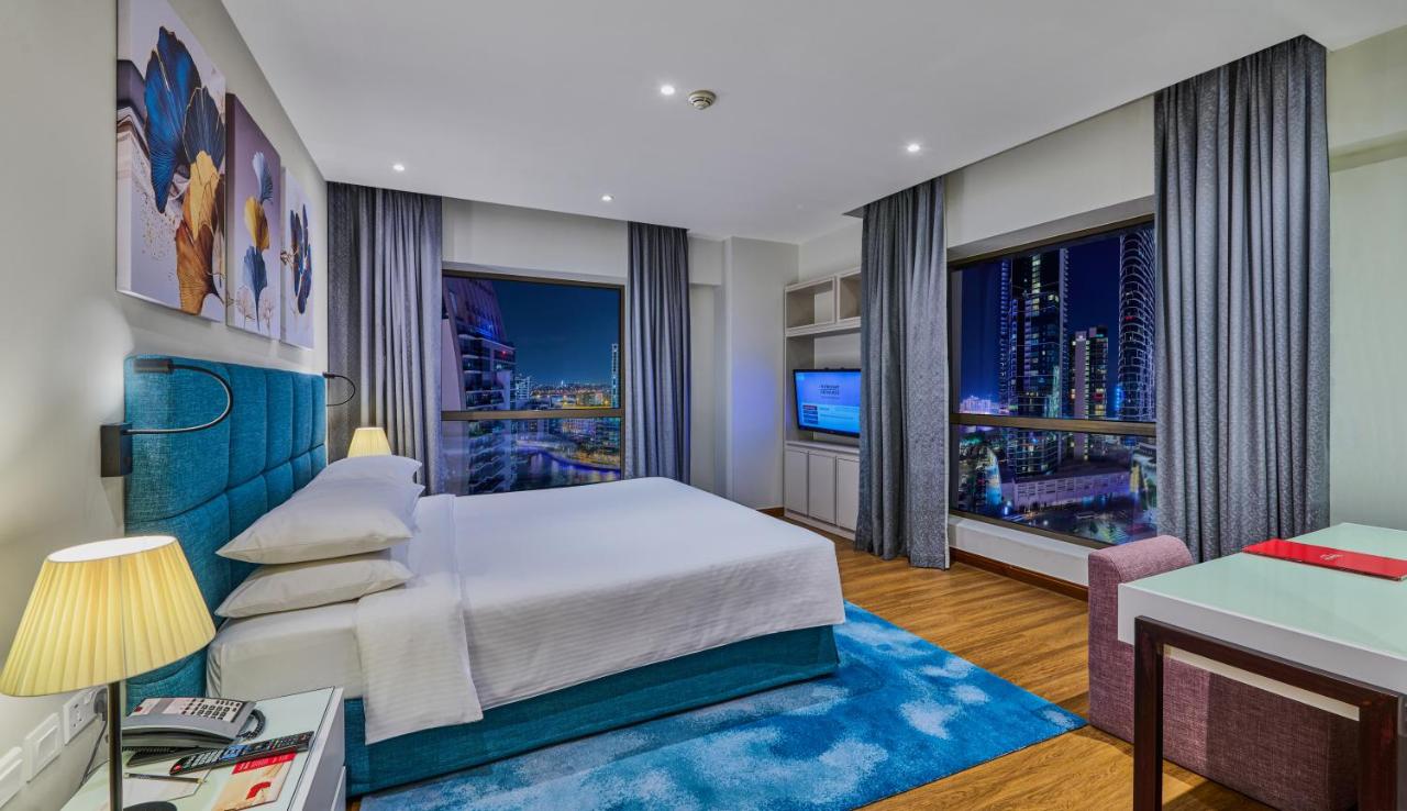 One-Bedroom King Suite with Balcony and City View