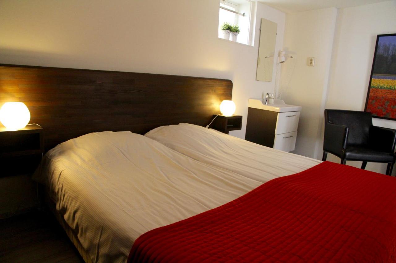 Een bed of bedden in een kamer bij budget rooms Doppenberg