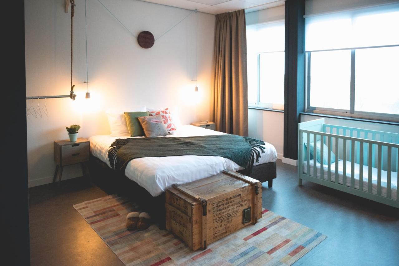 Een bed of bedden in een kamer bij Hotel Nimma