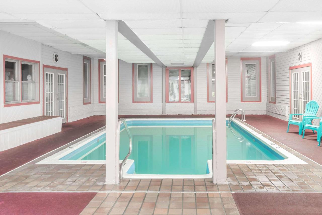 Heated swimming pool: Ramada by Wyndham Groton