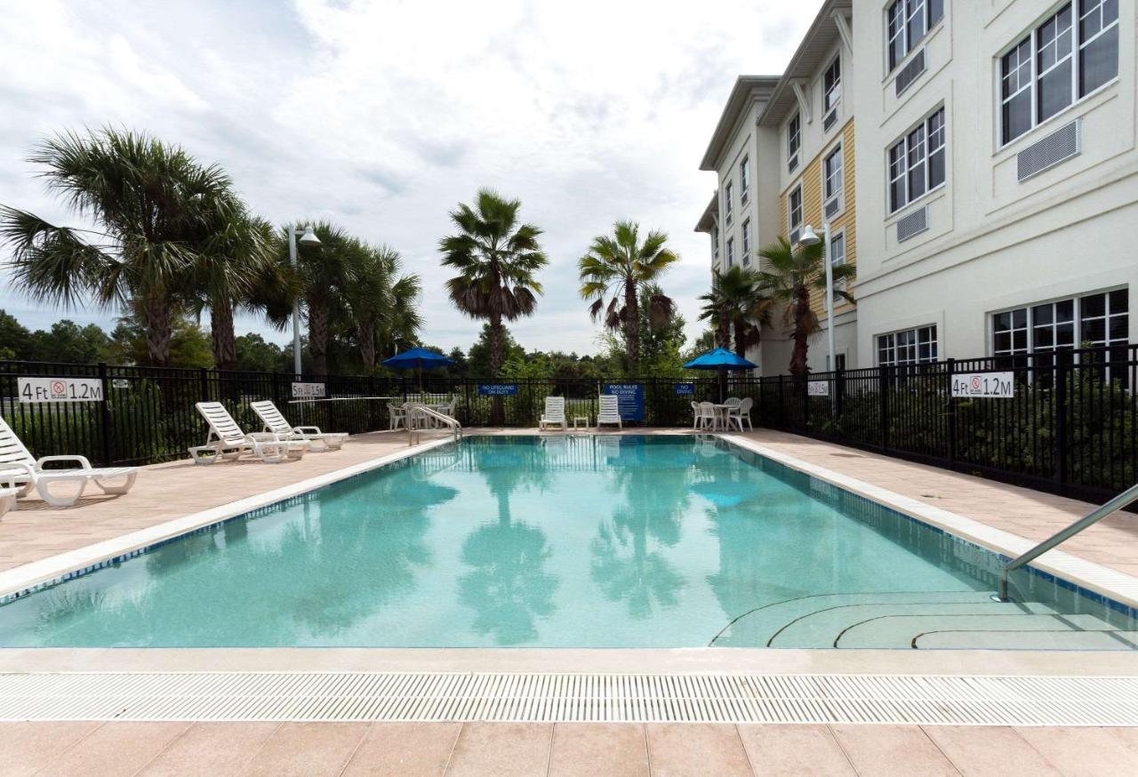 Heated swimming pool: Days Inn by Wyndham Palm Coast