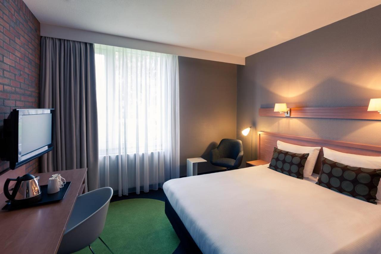 Een bed of bedden in een kamer bij Mercure Hotel Zwolle